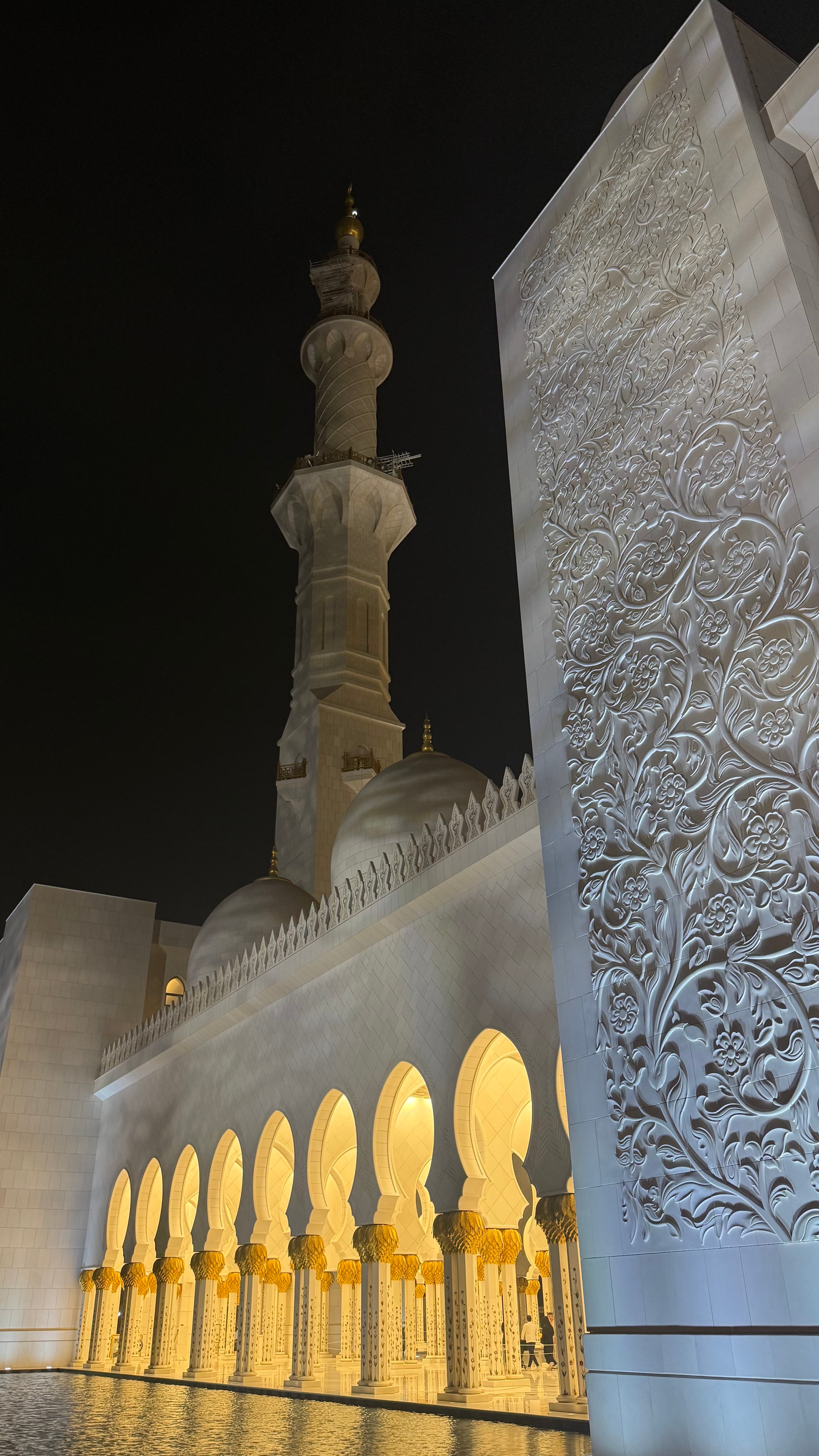 The white marble domes, minarets, and reflecting pools of the Sheikh Zayed Grand Mosque in Abu Dhabi