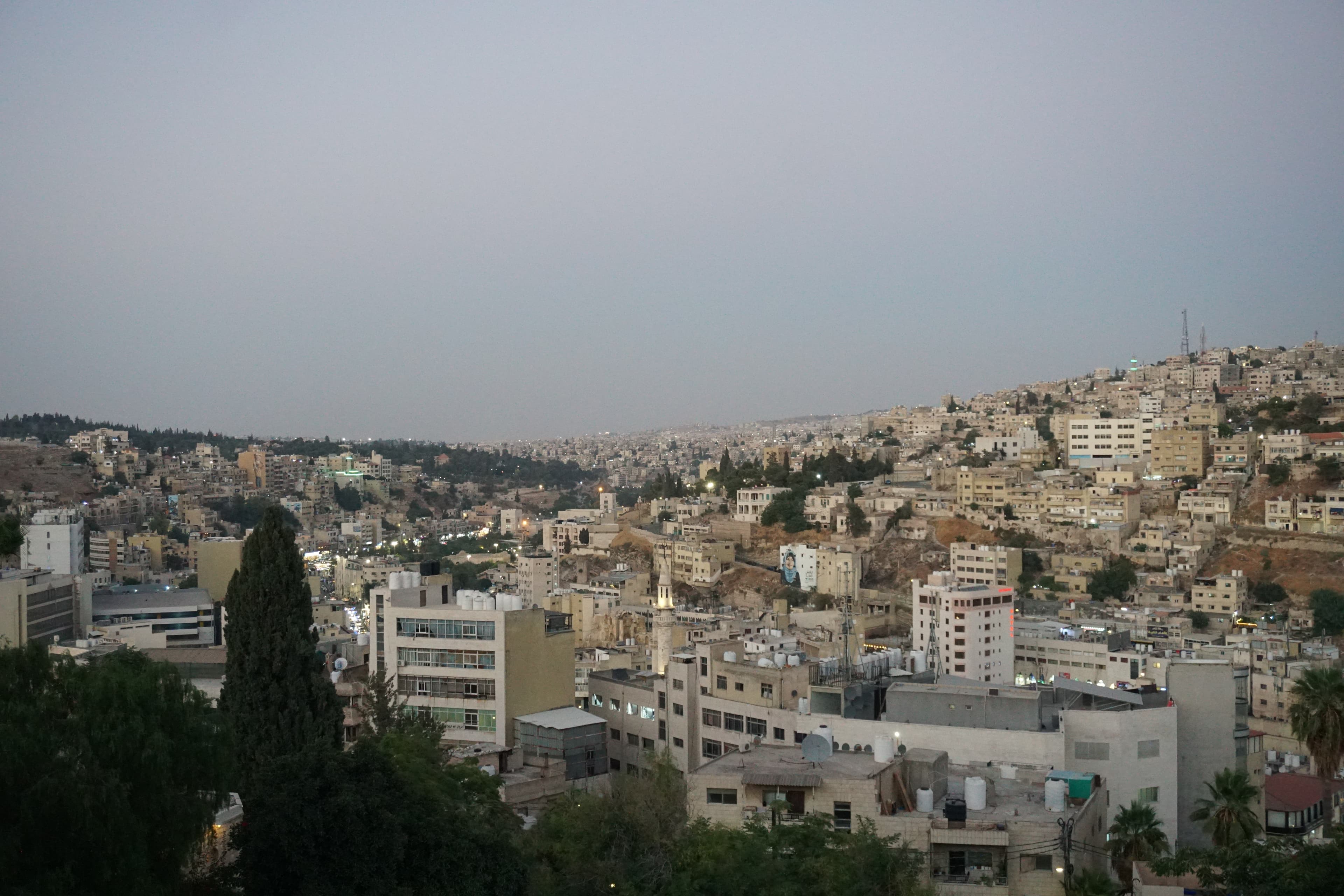 Sunset over the hills and lights of Amman, Jordan