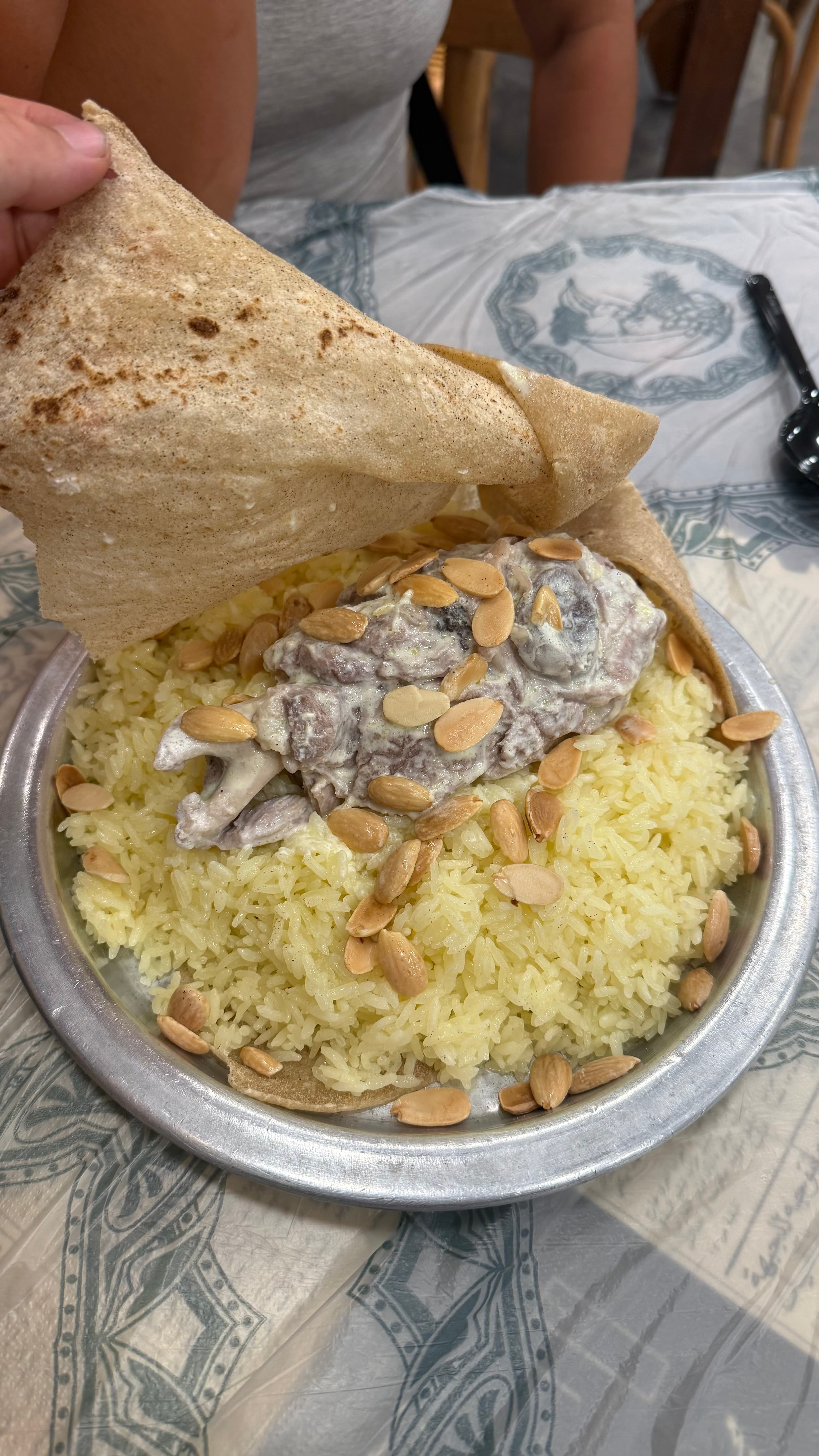 A platter of mansaf, Jordan's national dish of lamb, jameed, and rice, in Amman