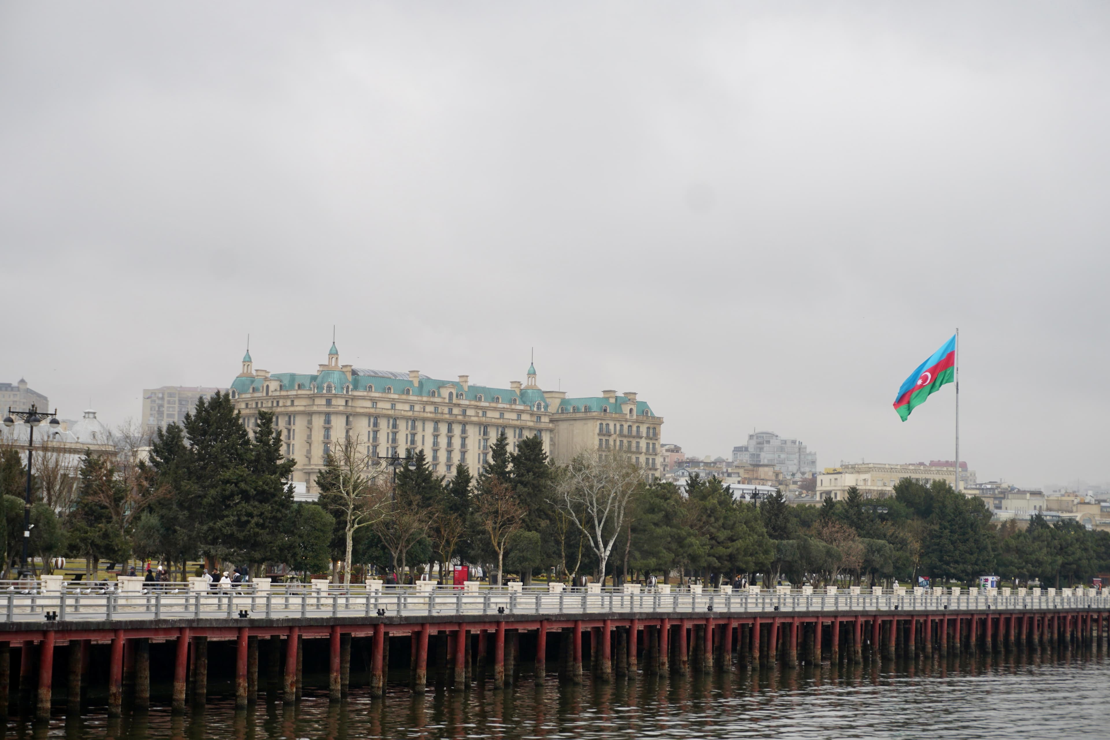 The Azerbaijani national flag flying over Baku