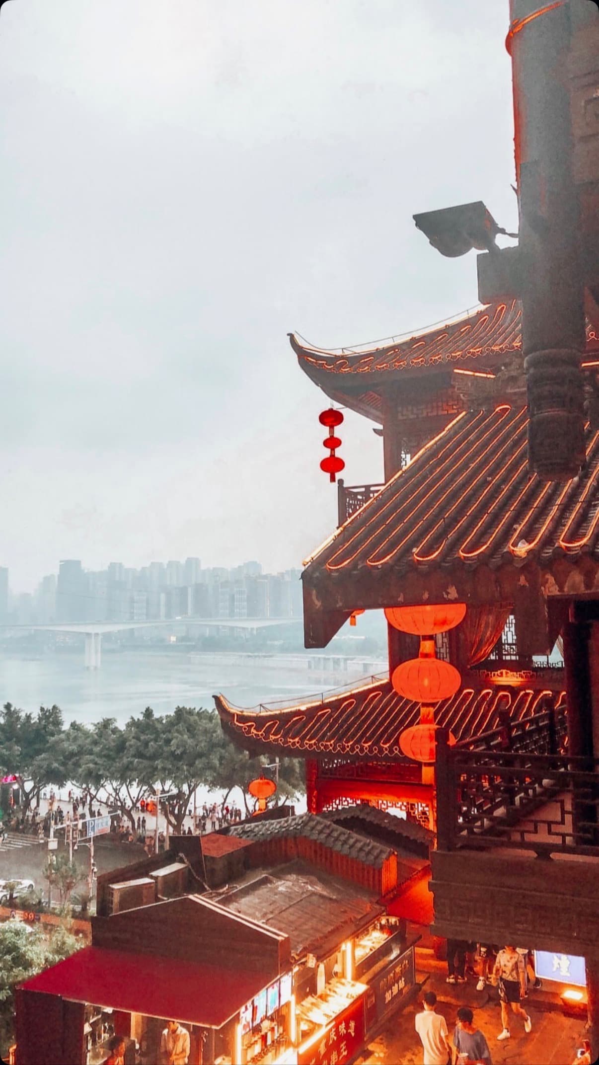 The tiered timber balconies of Hongyadong cascading down the cliff in Chongqing