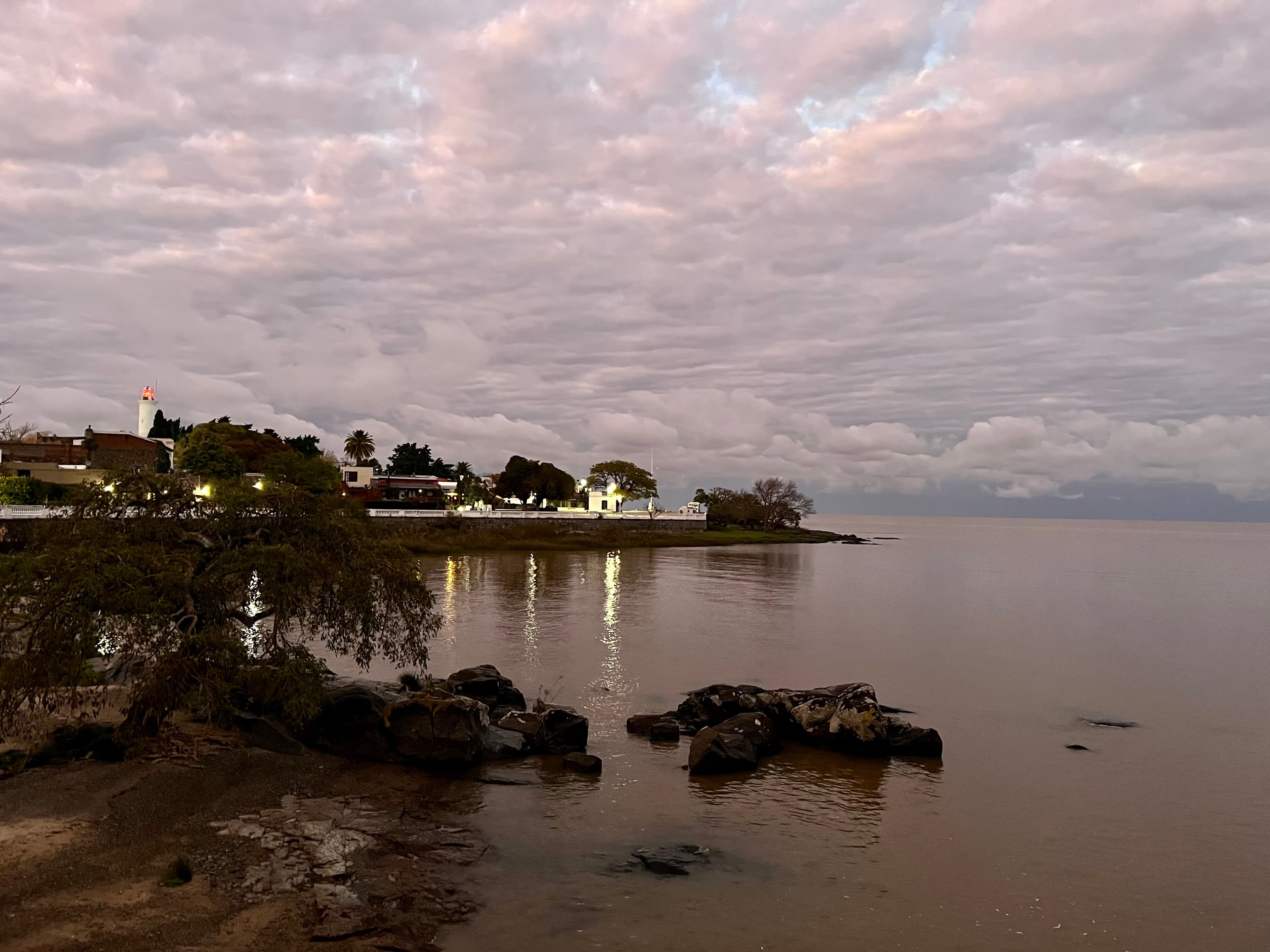 The lighthouse and Río de la Plata waterfront at dusk in Colonia del Sacramento