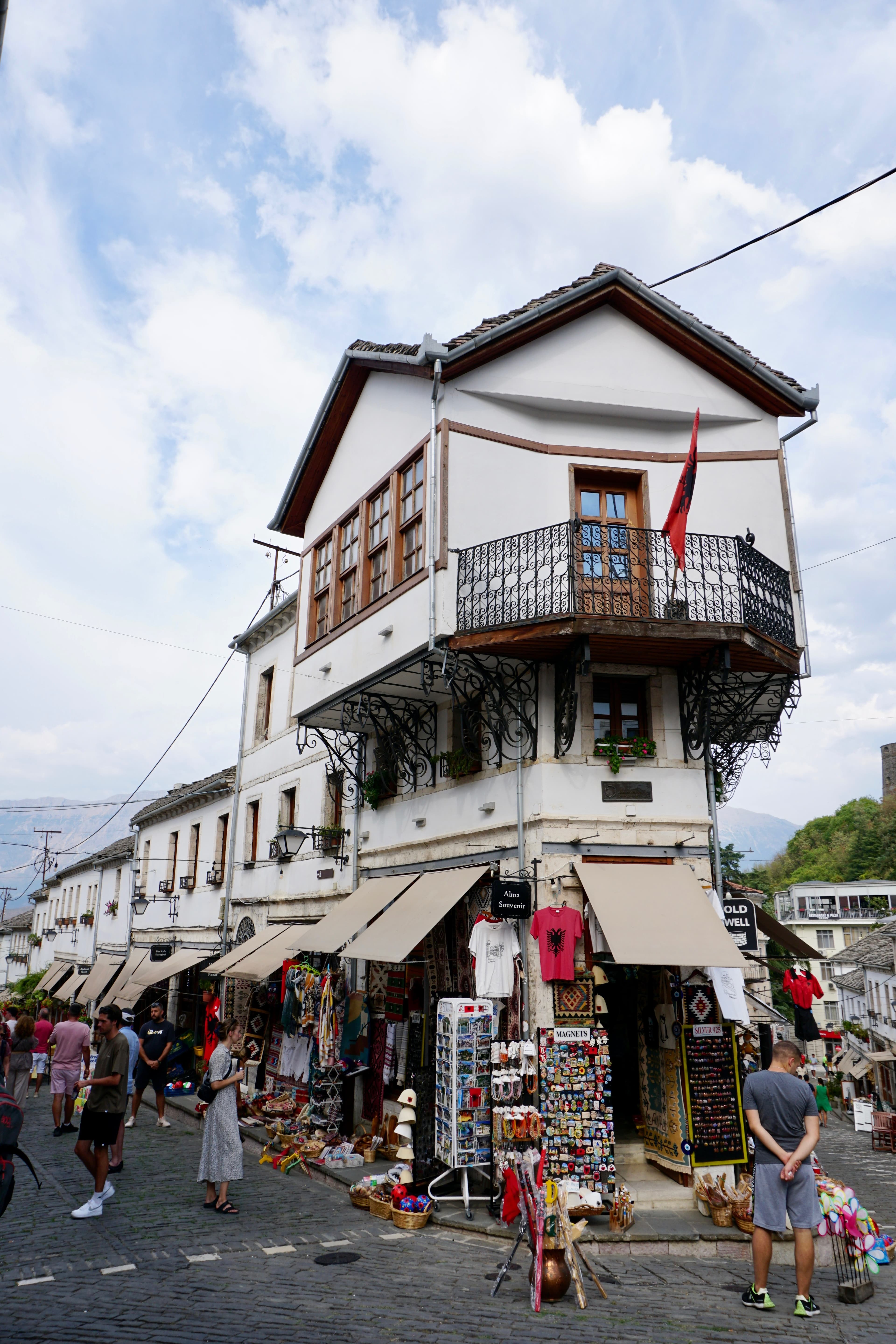 Stone houses and rooftops of Gjirokastër climbing the hillside, the City of Stone