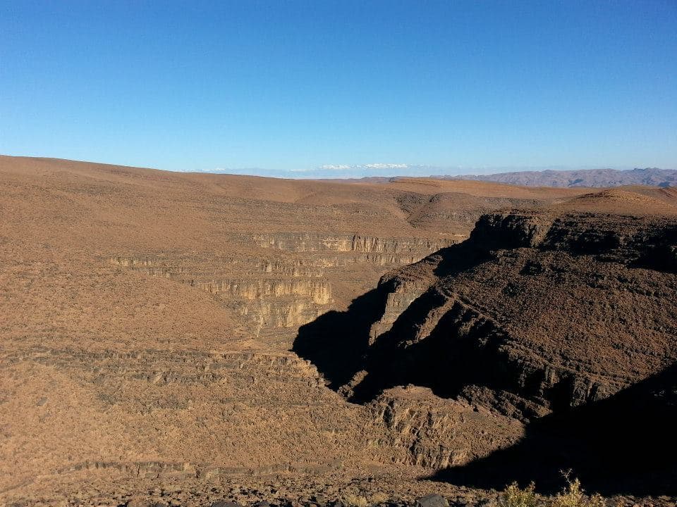 A deep canyon cut into the bare High Atlas plateau on the road south from Marrakesh to Zagora