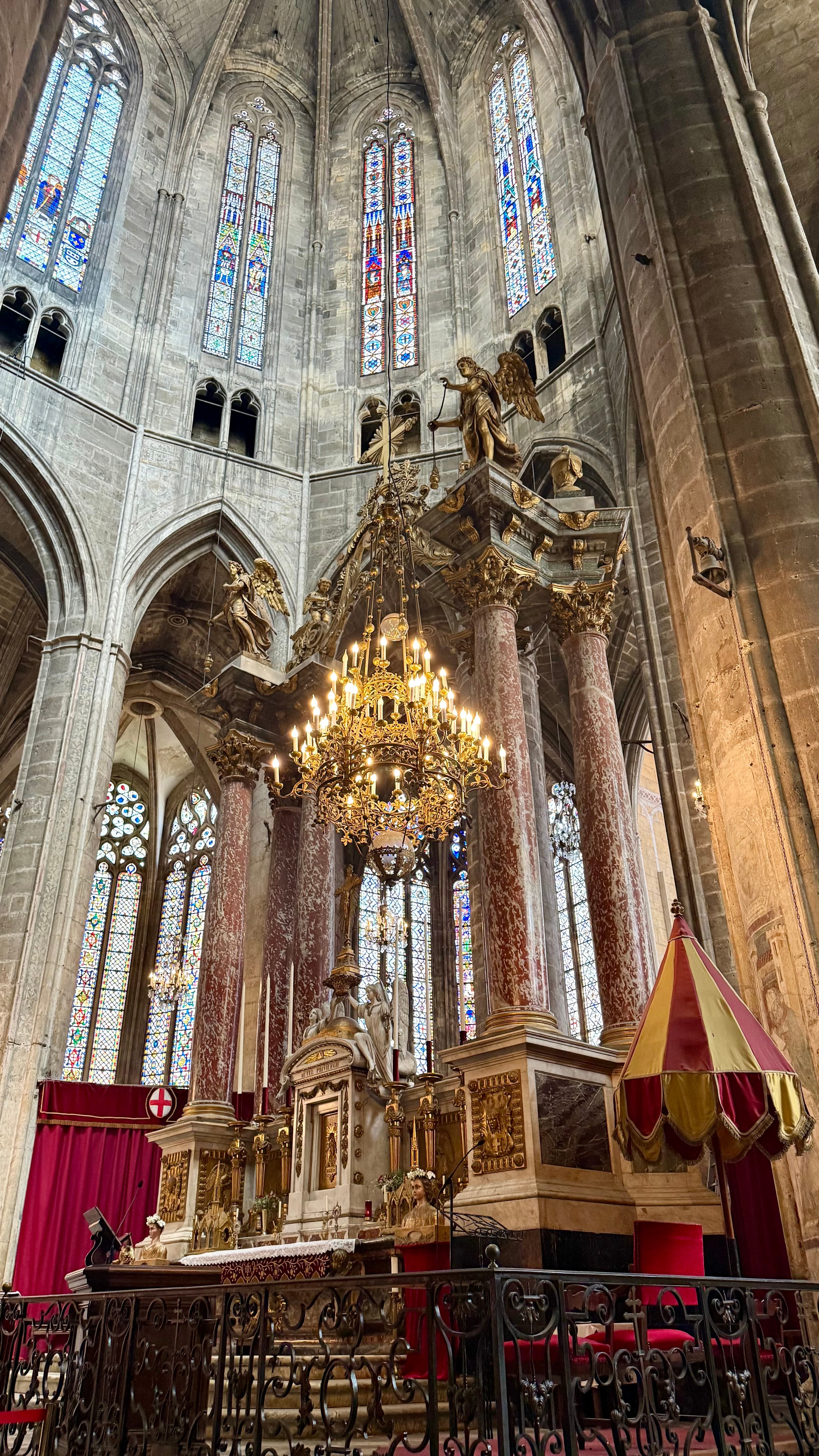 The high vaults and stained glass inside Narbonne's unfinished cathedral