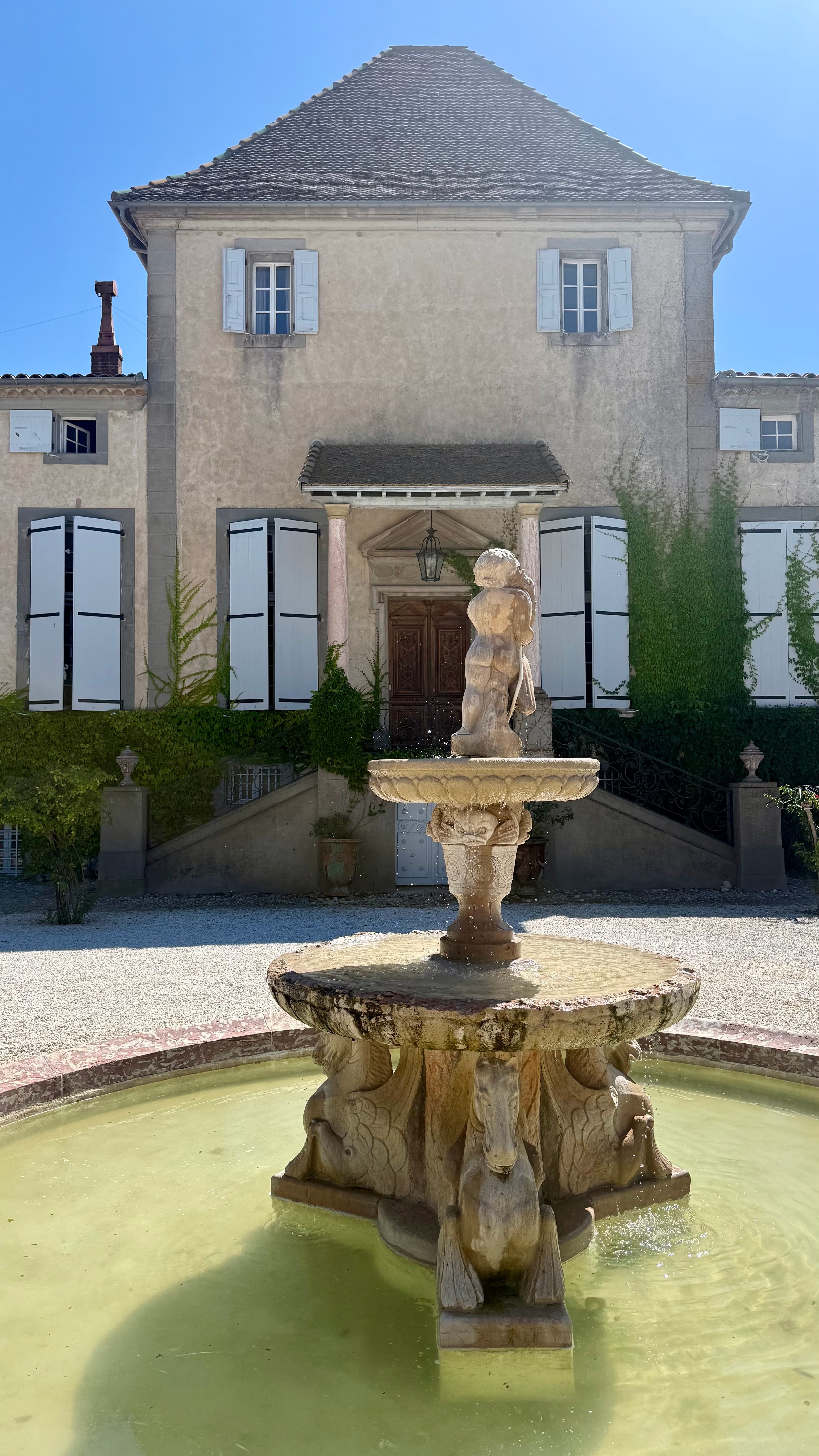 The facade of Château de Paraza above the Canal du Midi in the Minervois