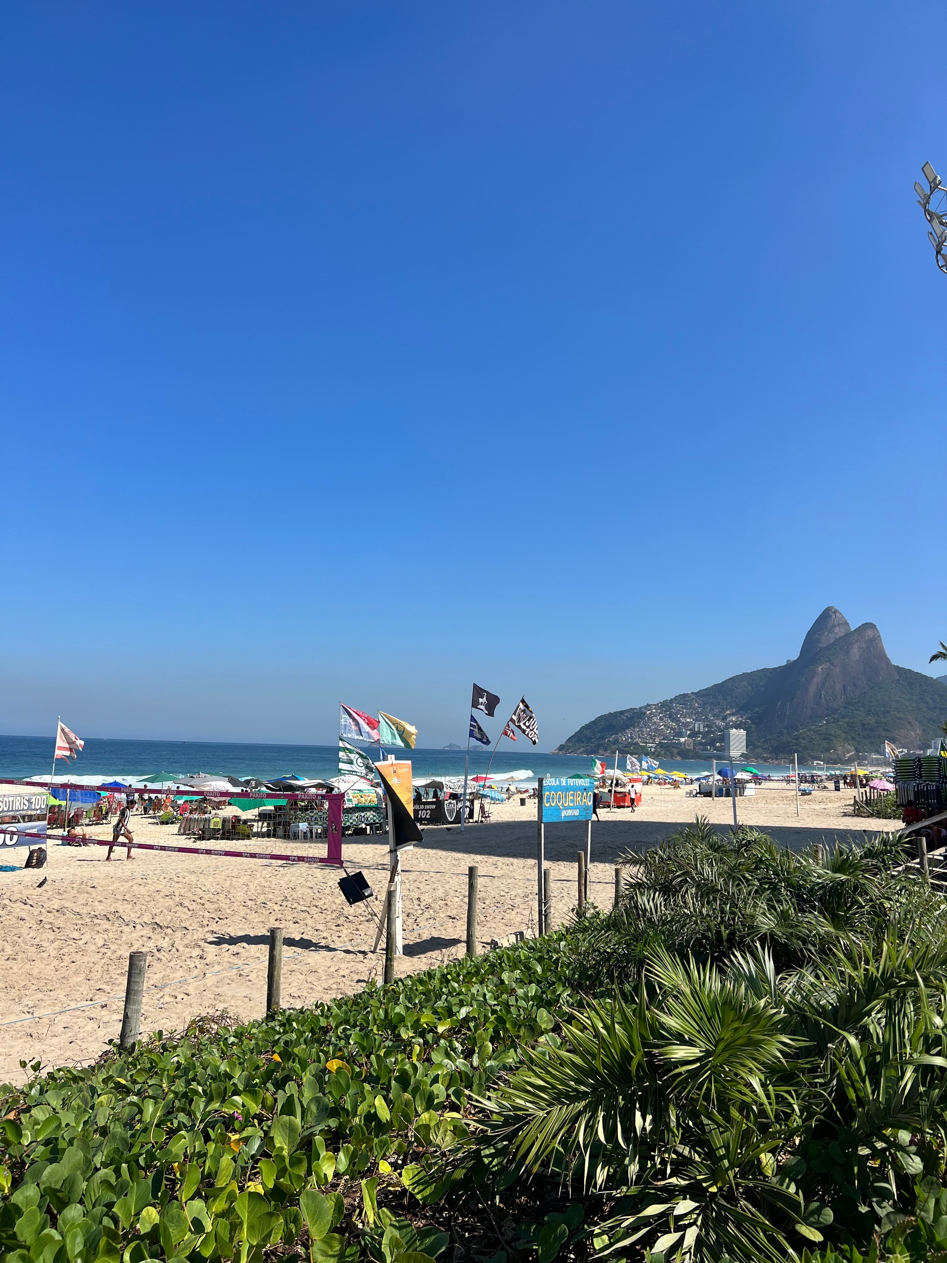 Ipanema beach and the Dois Irmãos peaks seen from the sand in Rio de Janeiro