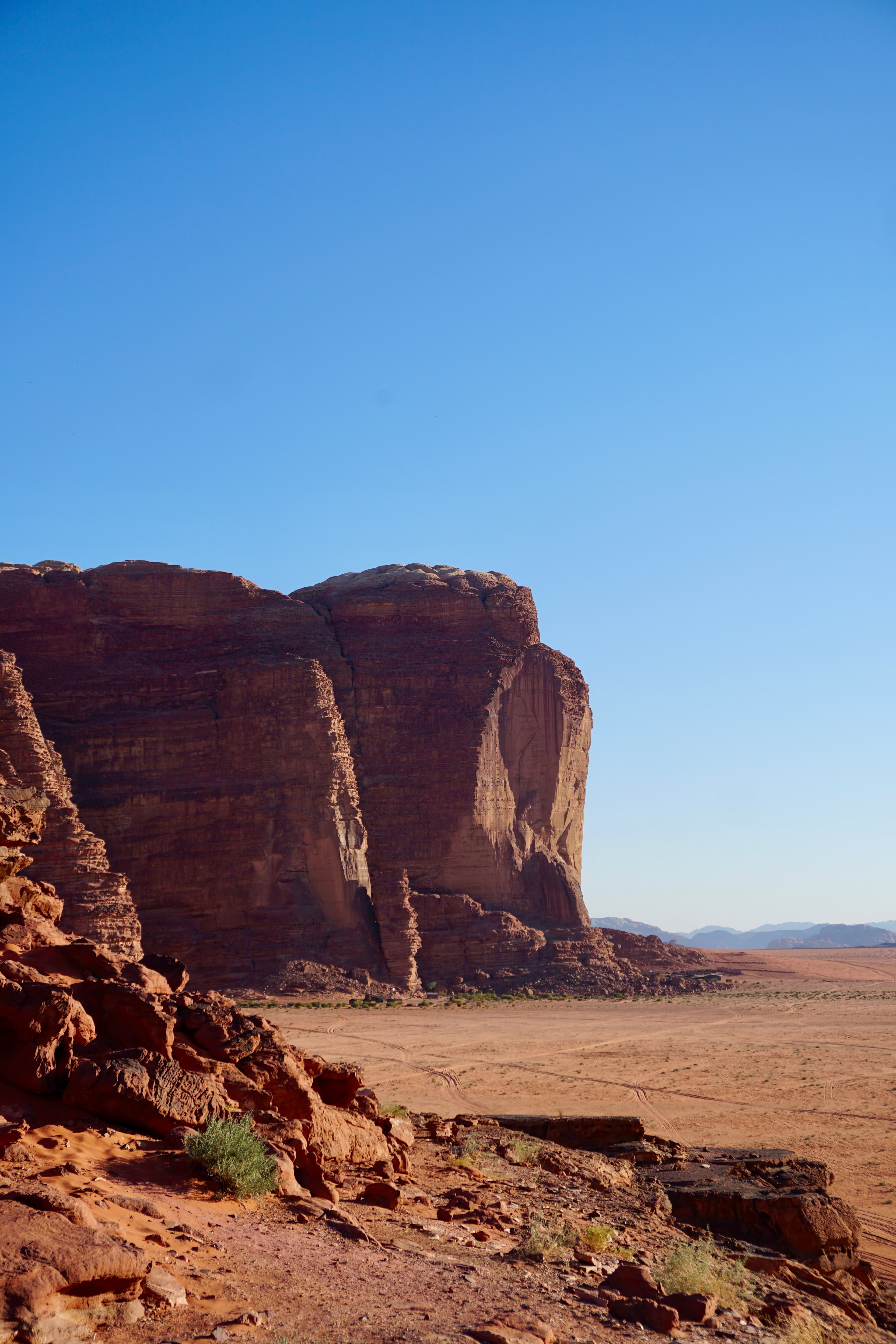 The wide red-orange sands and rock formations of Wadi Rum's protected area