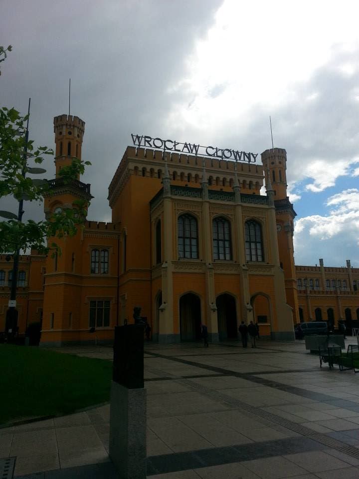 The neo-Gothic orange facade of Wrocław Główny railway station, Poland